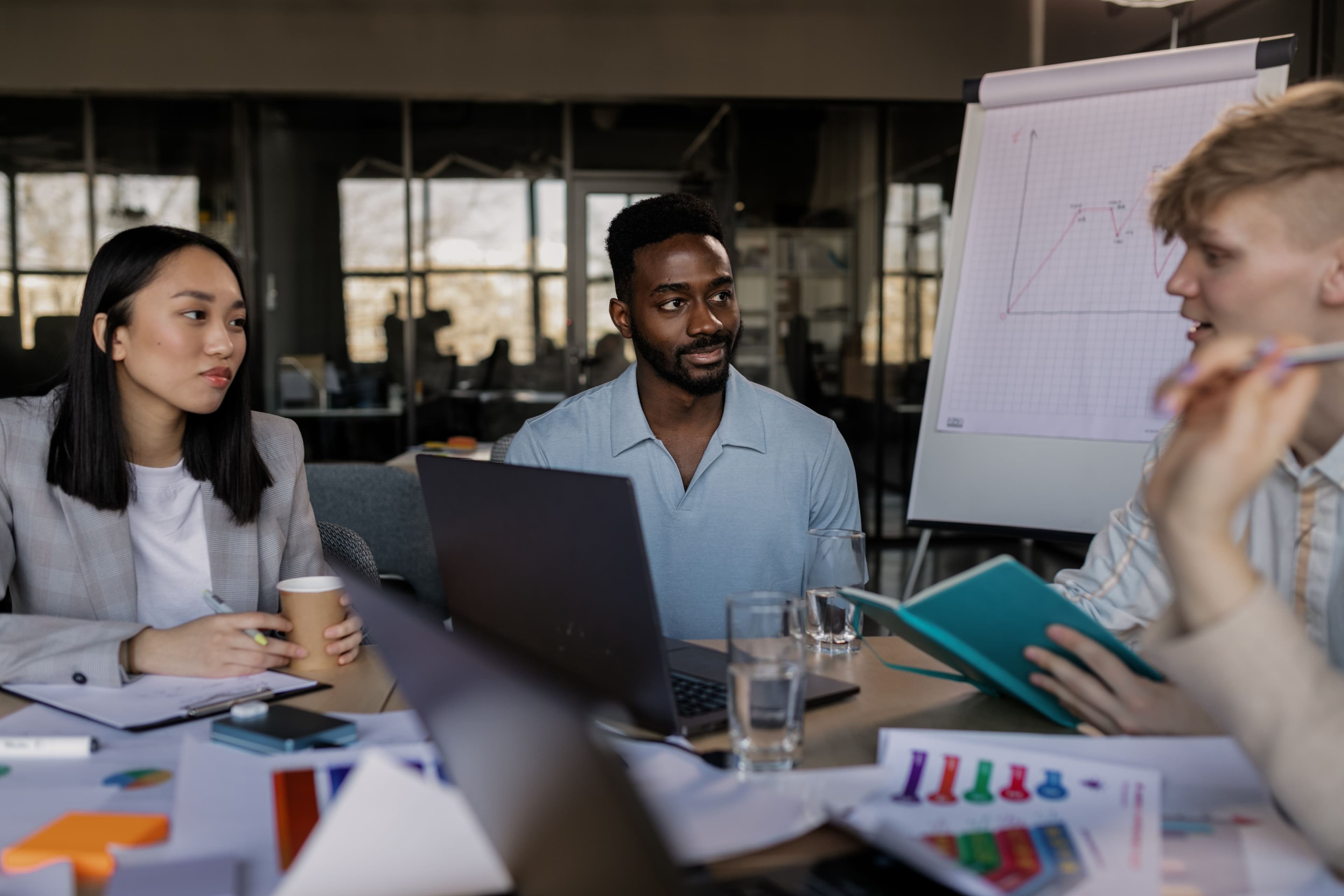 A small team in a meeting around a conference table